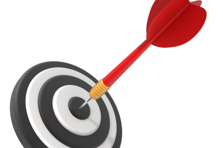 A red dart hits the center of a black-and-white target.